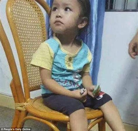 Chinese Girl Is Abandoned Outside A Public Toilet By Her Mother After