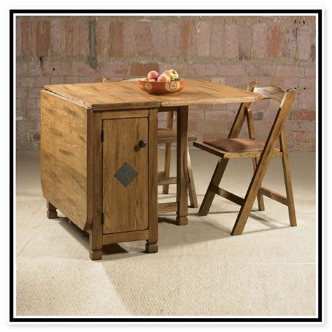 Which dining table set is better, wood or glass top? Adorable Drop Leaf Table with Chair Storage - HomesFeed