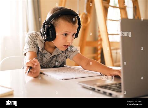 Boy Using Computer With Headphones Hi Res Stock Photography And Images
