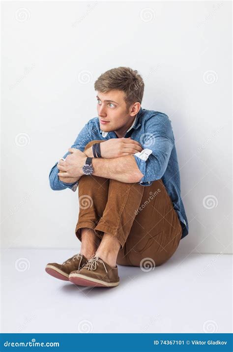 Funny Scared Man Sitting On The Floor In Studio Stock Image Image Of