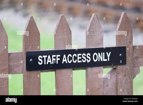 Staff Access Only Sign On Wooden Gate At Private Railway Stock Photo