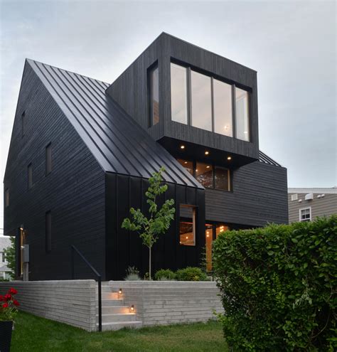 The Black Roof Siding And Window Frames On This Home Combine To Make
