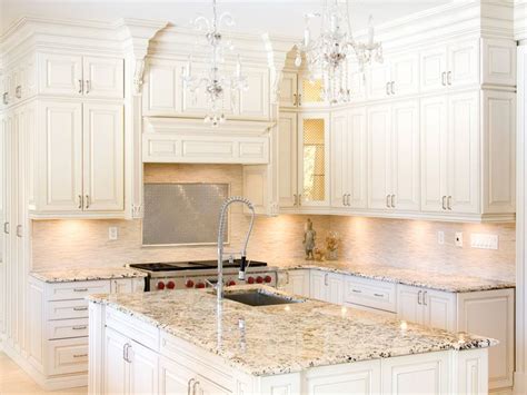 I am having a hard time deciding on backsplash material and color (and maybe grout color) that will tie everything together without one piece looking too y. White kitchen cabinets with delicatus granite countertops ...