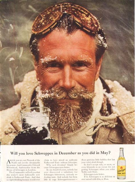 An Old Man With A Beard Holding A Beer