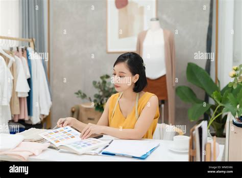 A Young Fashion Designer Working On Her Atelier Stock Photo Alamy