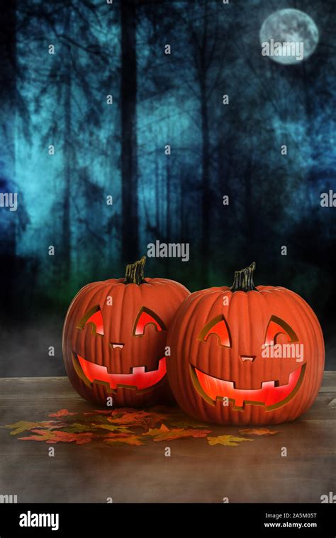Halloween Glowing Pumpkins With Fog Stock Photo Alamy