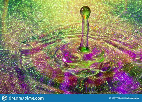 Sparkly Rainbow Water With Droplet In Motion Stock Photo Image Of