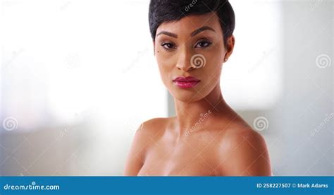 Close Up Of Gorgeous Nude Black Female In Her S Staring At Camera