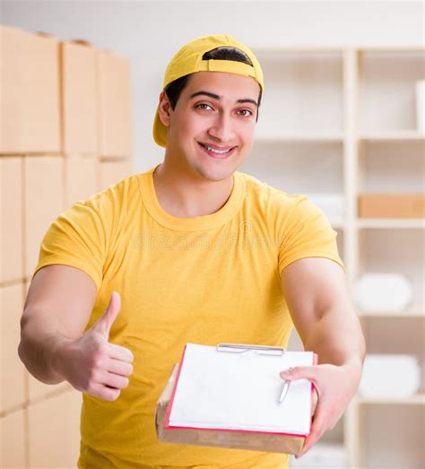 Man Working In Postal Parcel Delivery Service Office Stock Image