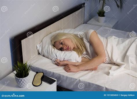 Young Beautiful Woman At Home Bedroom Lying In Bed Late At Night Trying