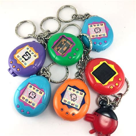 What could make a kid smile wider than a fun carton box filled with a cheeseburger, french fries, a cookie, a drink, and one of the signature free happy meal toys? McDonald's Happy Meal Toys 1997 - Tamagotchi Key Chains ...