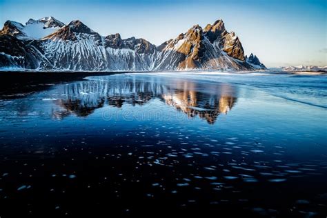 Perfect Reflection Of The Peaks Of Vestrahorn Stokksnes Iceland Stock