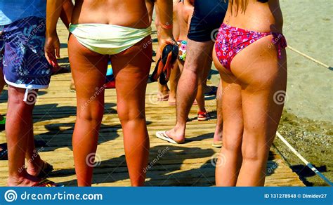 Company Of Girls Sunbathing On The Beach Stock Photo Image Of Joyful