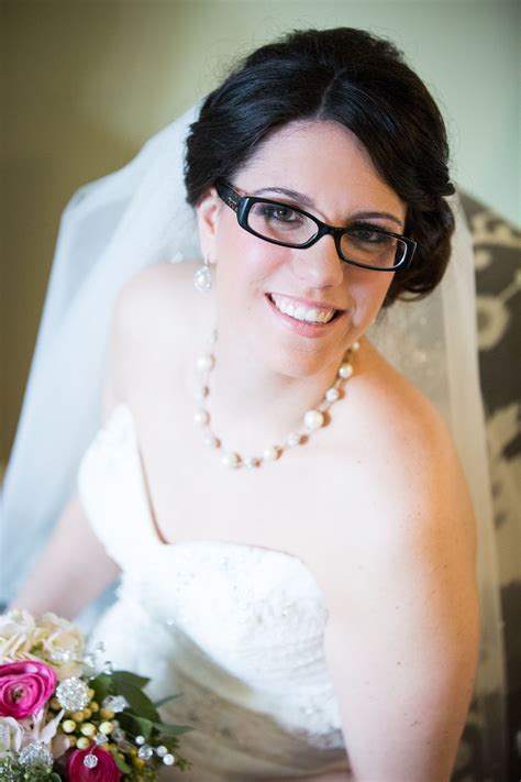 Bride With Side Updo Glasses Veil And Pearl Jewelry