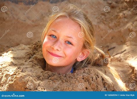 Little Girl Playing In Sand Stock Photo 16068594