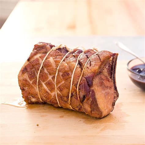 Slice the roast crosswise between the bones. Slow-Roasted Bone-In Pork Rib Roast Recipe - America's ...