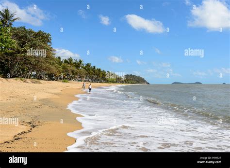Couple Walking On The Beach At Trinity Beach Cairns Northern Beaches