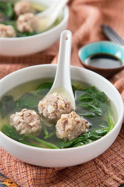 To prevent the stems from tasting woody, pull and discard the strings when snapping them to short lengths, discarding the bottom most ends (pic above). My Mom's Pork Meatball Spinach Soup | The Missing Lokness