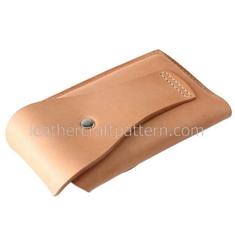 A Tan Leather Case With Buttons On It