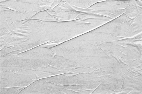 Пустой белый скомканный и мятый бумажный плакат текстуры фона Премиум