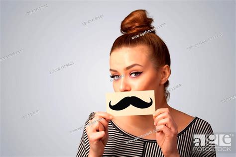 Happy Cute Girl Holding Paper With Mustache Drawing Stock Photo