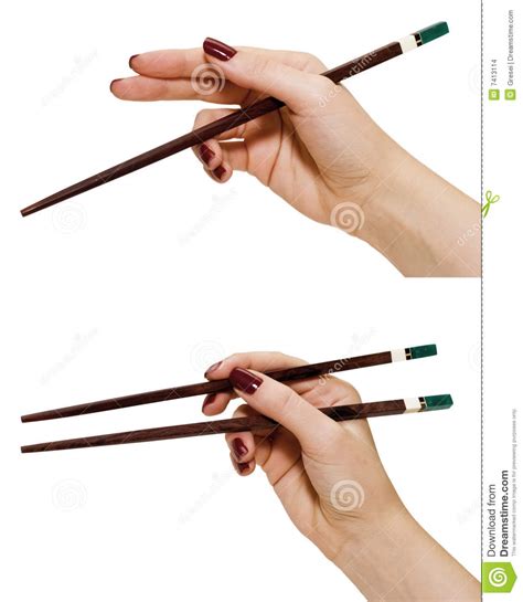 Though these first utensils were likely used for cooking instead of eating, they became eating instruments during the han dynasty and were fully integrated into daily meals during the ming dynasty. Hands holding chopsticks stock photo. Image of hold, implements - 7413114