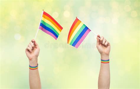 Hand With Gay Pride Rainbow Flags And Wristbands Stock Image Image Of