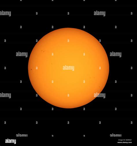 The Sun Seen With Telescope From Planet Earth With Sunspots Visible As