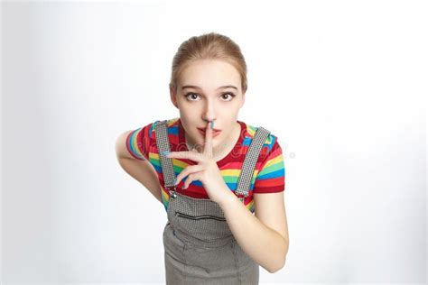 The Girl Raised Her Index Finger To Her Mouth In Amazement Advertising Concept Stock Image