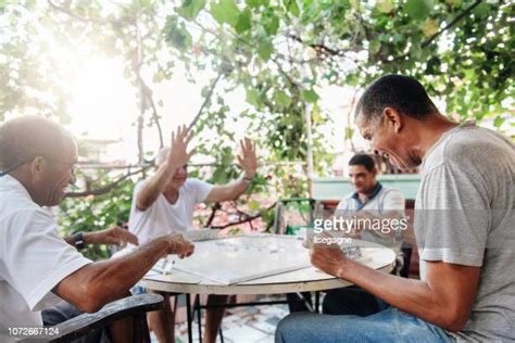 Men Playing Dominos Photos And Premium High Res Pictures Getty Images