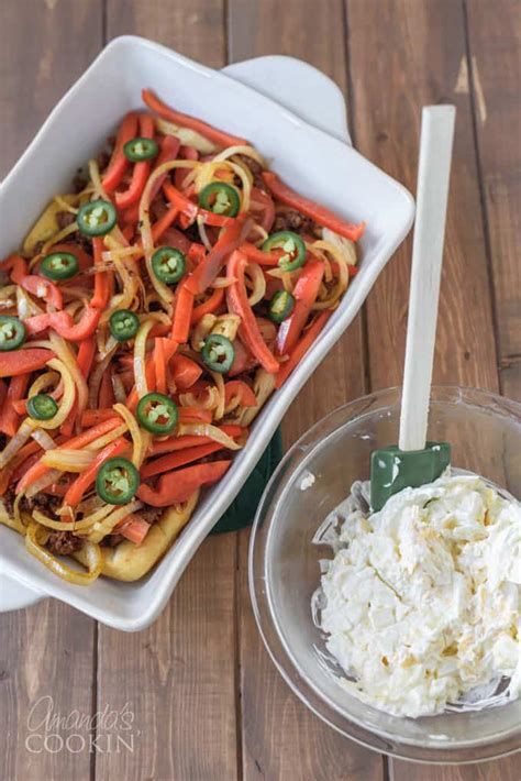 This layered casserole has the delicious flavors of peppers, onions, and beef, all smothered in sour cream and cheddar cheese. John Wayne Casserole - a great ground beef option