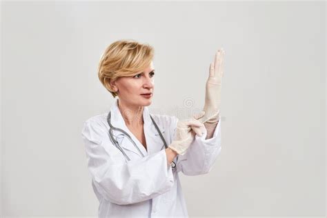 Adult Female Doctor Put Latex Glove On Her Hand Stock Photo Image Of