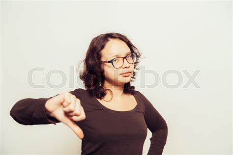 Woman Showing A Thumb Down Gesture Stock Image Colourbox