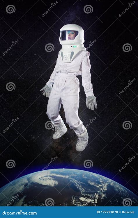 Astronaut In Space In Zero Gravity Near Planet Earth Stock Photo