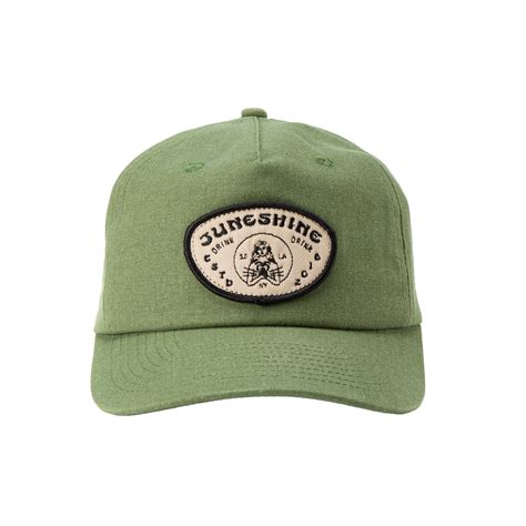 Front View Green Dad Hat With An Oval Patch That Reads June Shine Drink Drink Estd 2018 Sd Ny