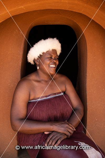 Photos And Pictures Of Basotho Woman In A Traditional Hut Thaba Bosiu Cultural Village