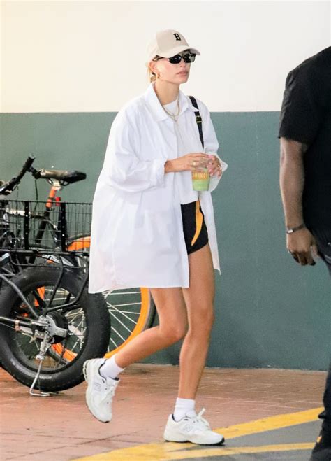 Hailey Bieber Takes Retro 90s Style For A Spin In Oversized Button Down And New Balance Sneakers