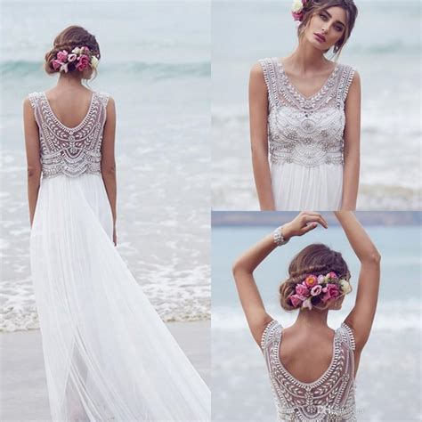 Beach volleyball, or sand volleyball, is an olympic team sport played by two teams of two players on a sand court divided by a net. Anna Campbell 2016 Wedding Dresses Beading Crystals ...