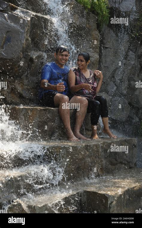 Indian Young Romantic Couple Taking Bath Having Fun In Swimming Pool To