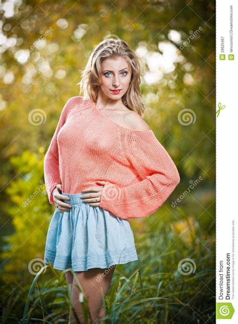 Beautiful Elegant Woman In Pink Sweater In Autumn Park