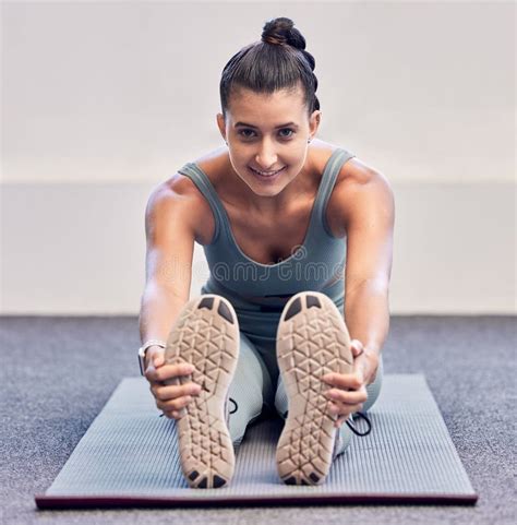 yoga fitness and portrait of woman stretching on mat before workout with smile on face a girl