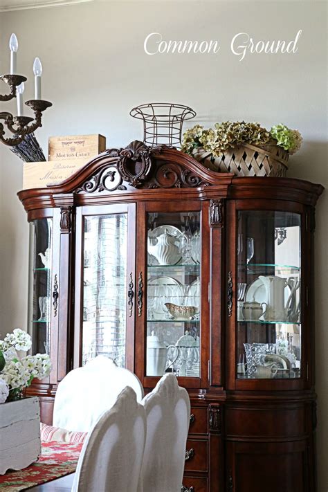 If you have valuable items to display, this is the cabinet of choice. common ground : Ideas on Styling a Cabinet or Cupboard Top