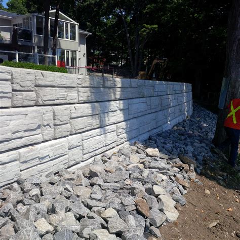 For best results, don't plan out the curve of your concrete retaining wall freehand. Retaining Walls- Boyd Bros Concrete | Ottawa Precast SpecialistsBoyd Bros Concrete | Ottawa ...