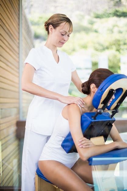 Premium Photo Physiotherapist Giving Shoulder Massage To Woman