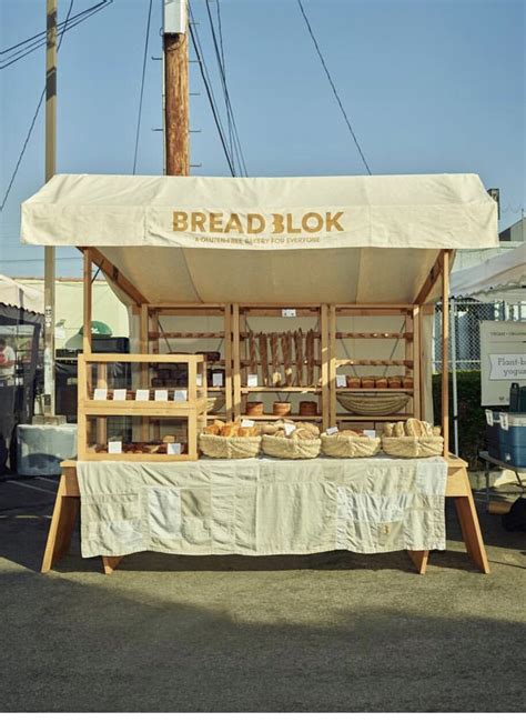 An Outdoor Food Stand With Bread On It