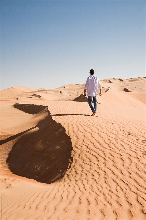 Man Walking Alone In The Desert Del Colaborador De Stocksy Mauro