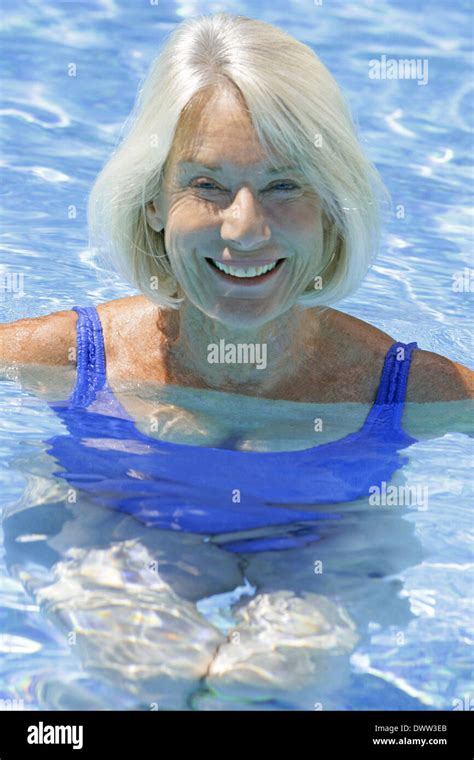 Active Mature Lady Swimming In Swimming Pool Hoodoo Wallpaper