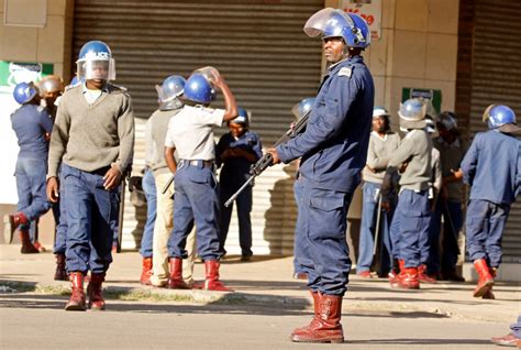 police and protesters clash in zimbabwe s capital pbs newshour