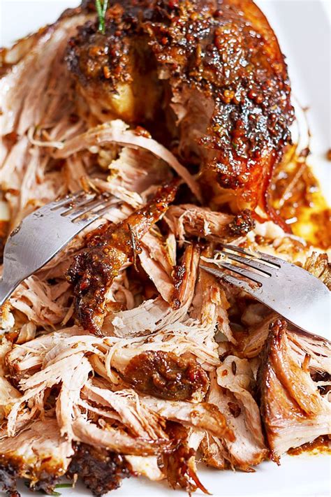 Using two forks, or cave tools pulled pork shredder rakes, shred the meat between them until it's finely separated, removing the shoulder bone once exposed. Slow-Roasted Pork Shoulder Recipe — Eatwell101