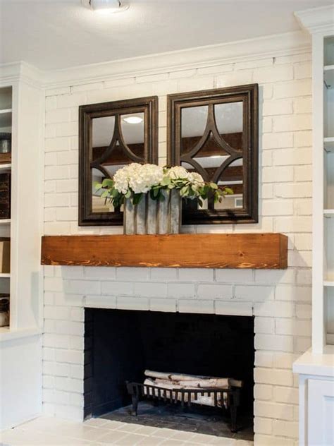 White Brick Fireplace With Dark Wood Mantel